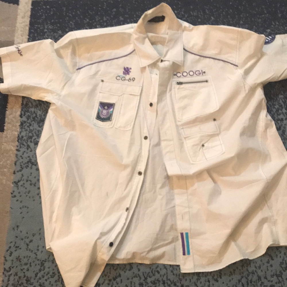 Coogi button up light stain on it can get out